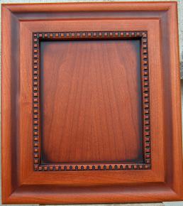 Molding decorated door panel for kitchen furniture